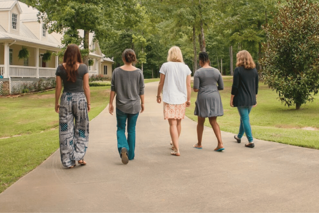 Magnolia Creek Grounds - employees walking on sidewalk